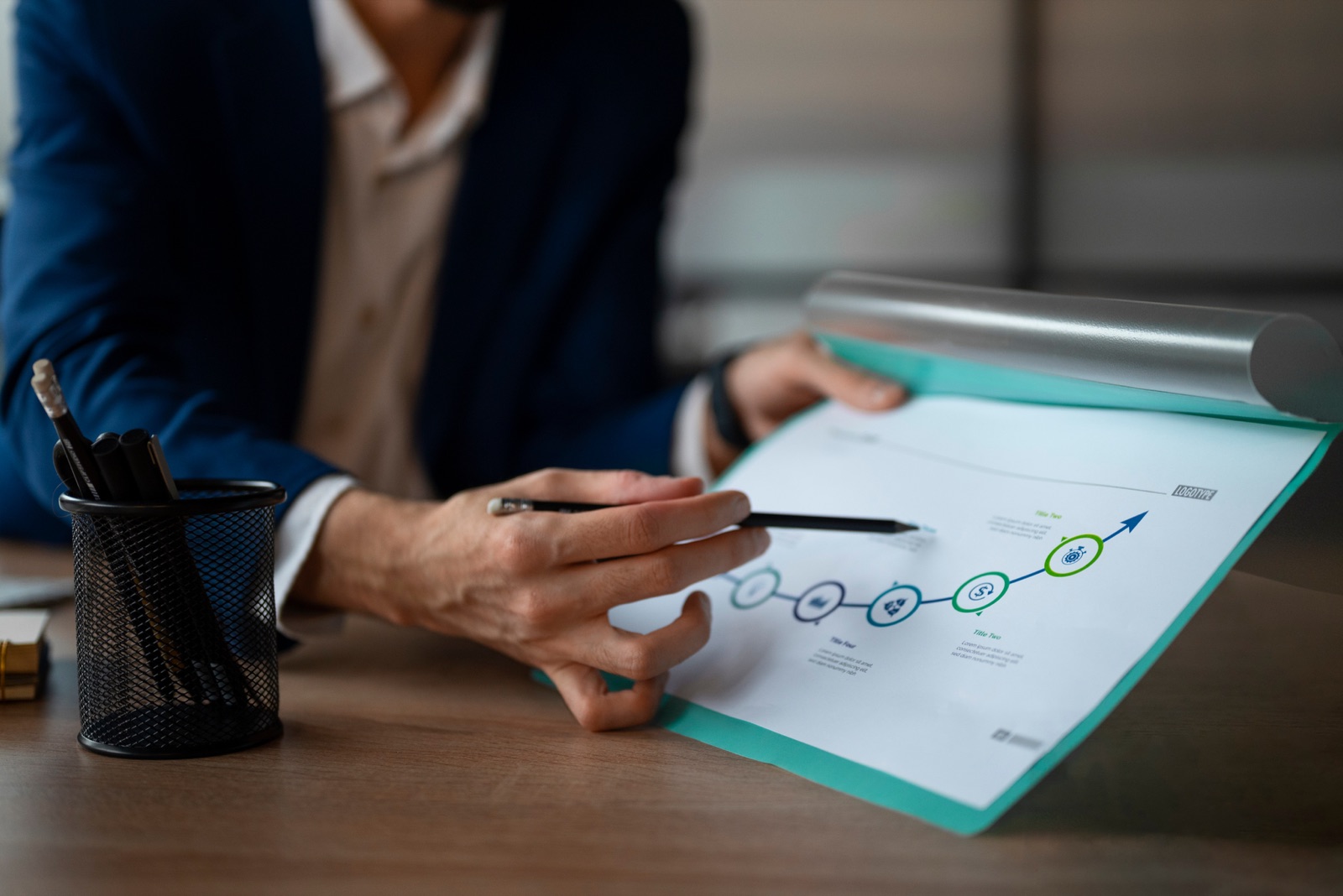 Consultant pointing at a milestone chart